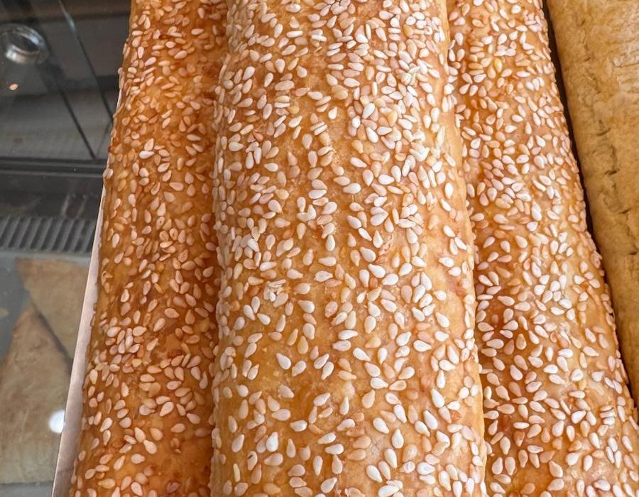 Sesame-topped cheese pastry rolls at Bakery Kissamos